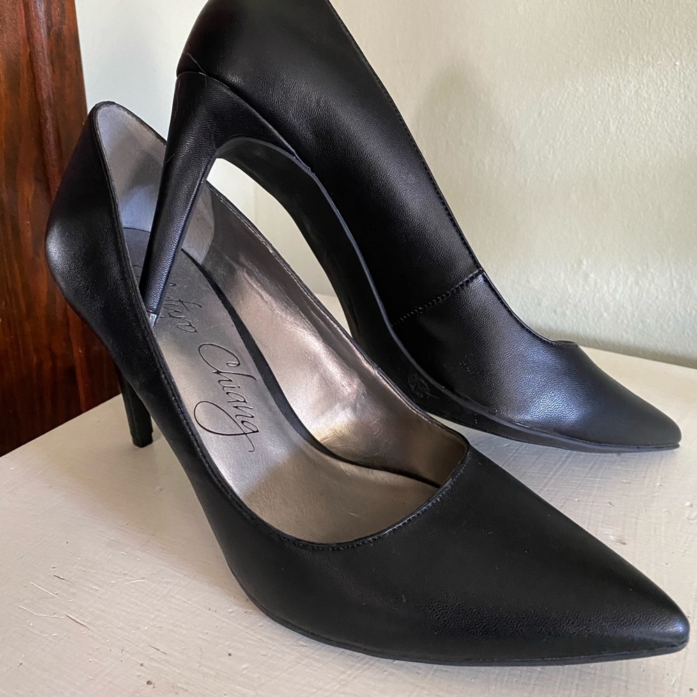 Black leather pumps, never worn outside.
